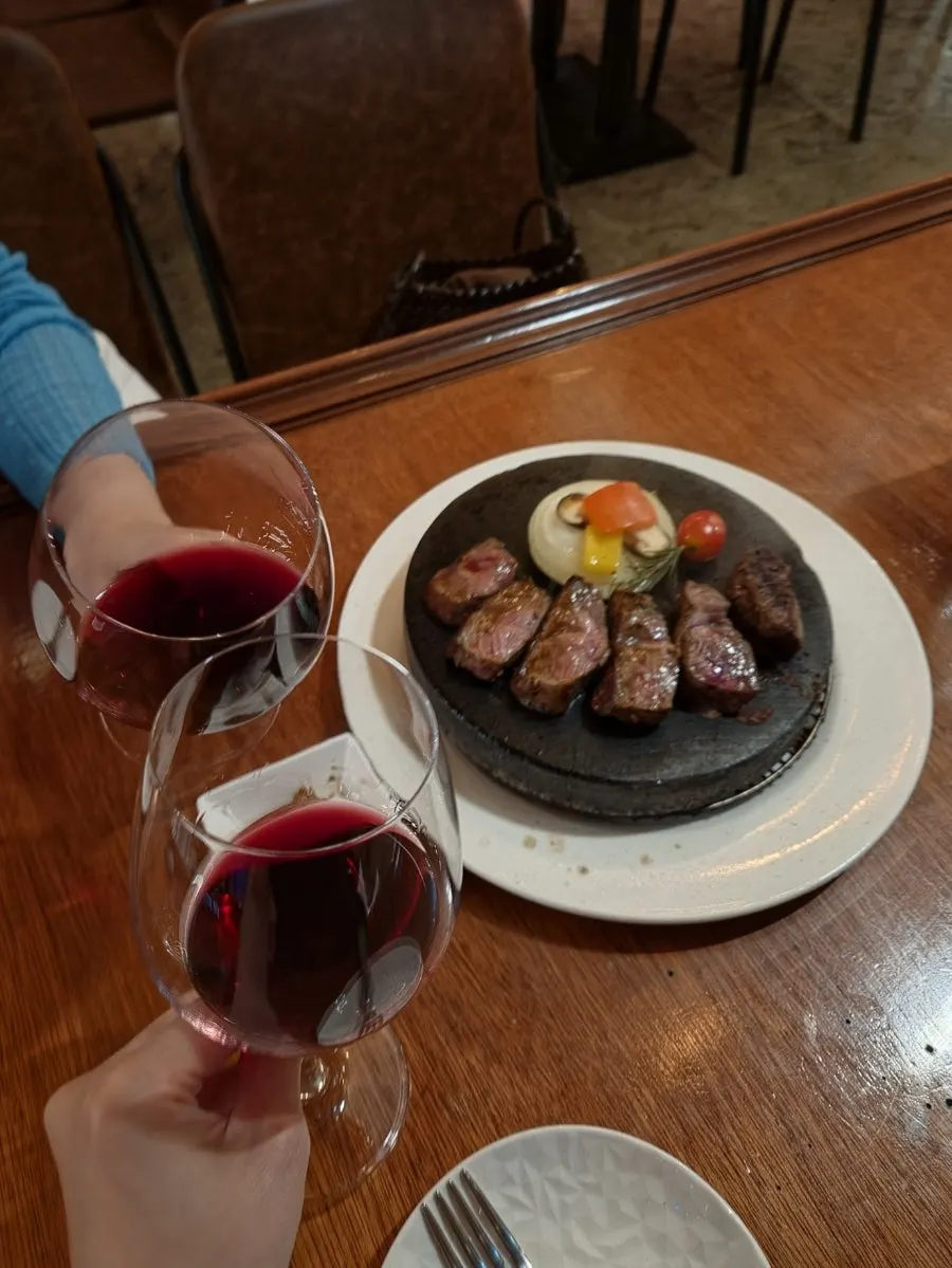 A glass of wine enjoyed with the steak