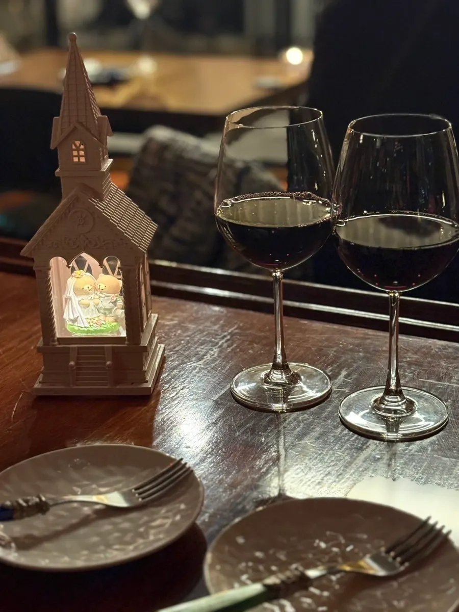 Two glasses of house wine on the table