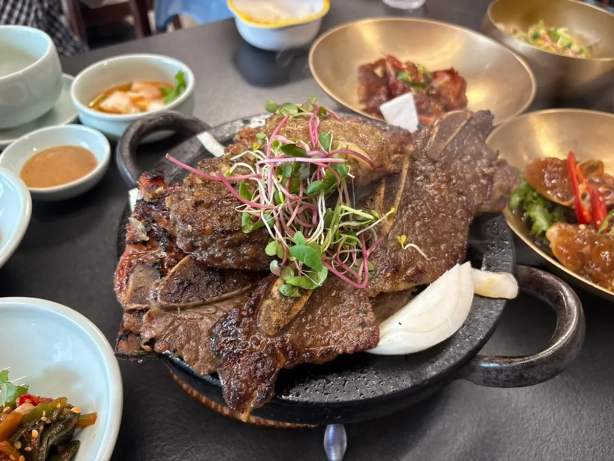 Full spread of the 2-person Set A with beef galbi, pork galbi, and tteokgalbi