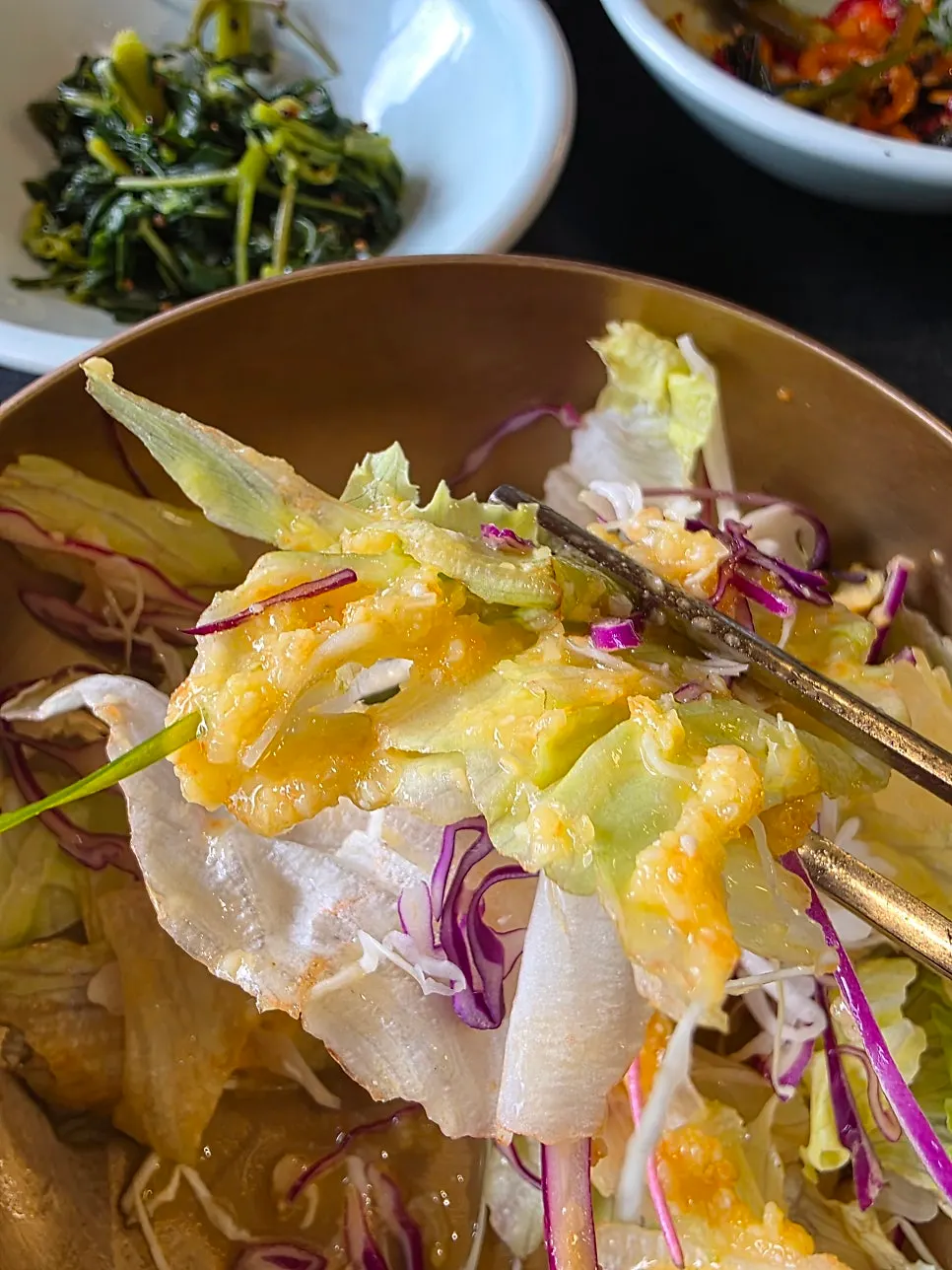 Charcoal galbi placed on top of bibim naengmyeon