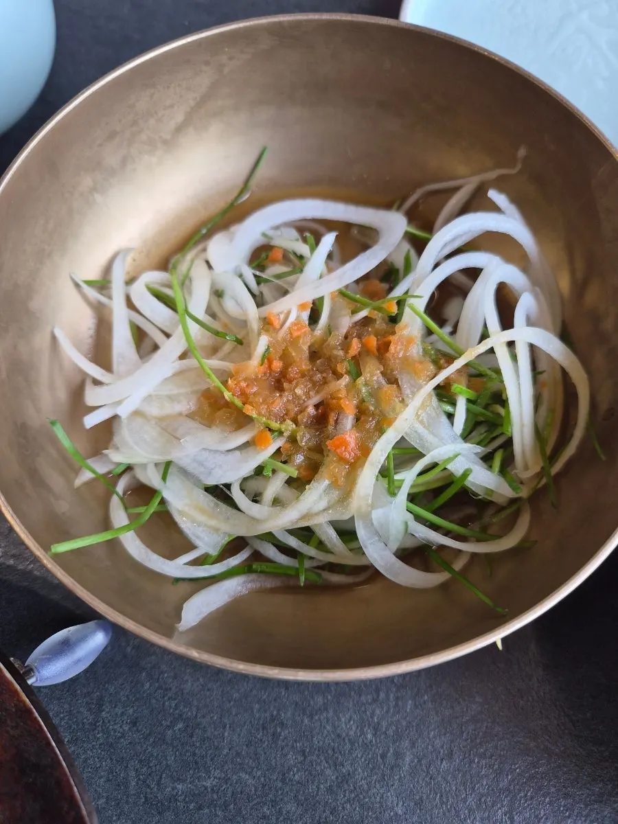 Cheonggukjang and salad in the table setting