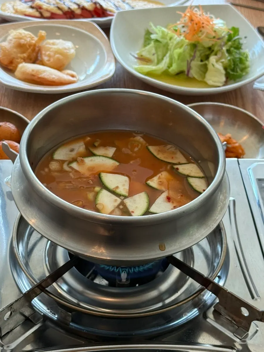 A table spread with a variety of banchan