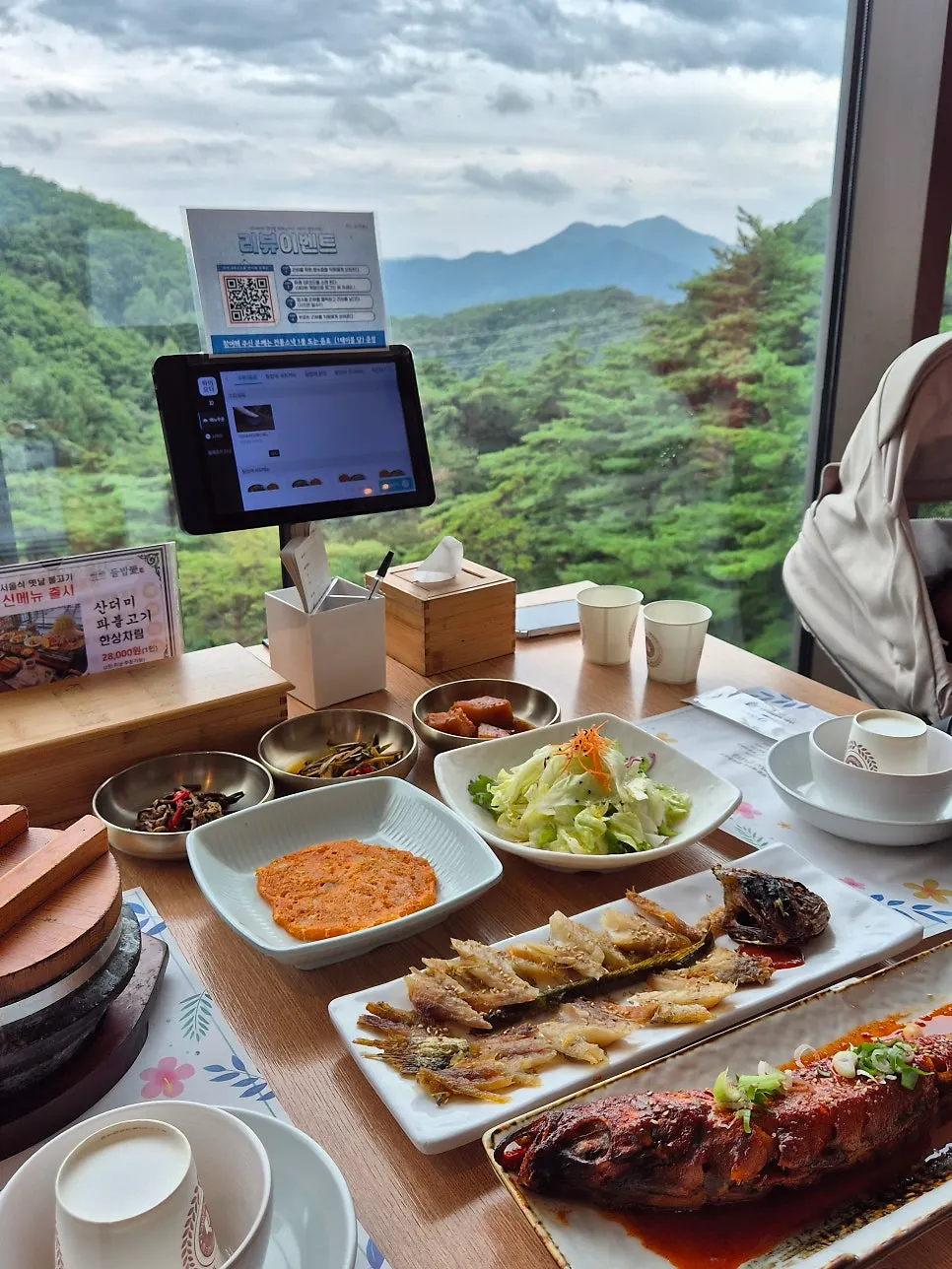 Meal at Deulbabae with a forest view from the window seat