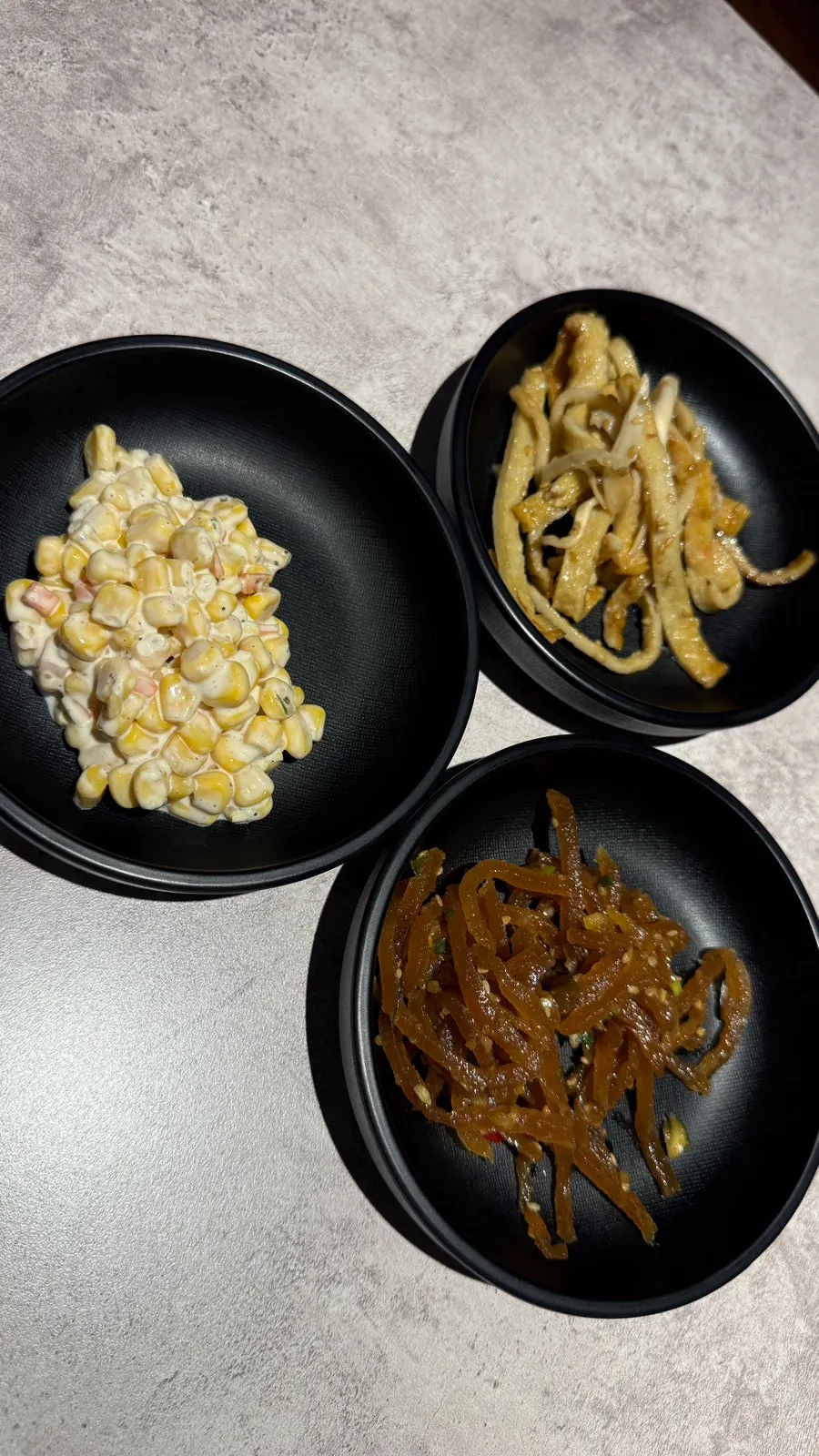 Basic side dish spread at Maeun Gieok including corn kernels