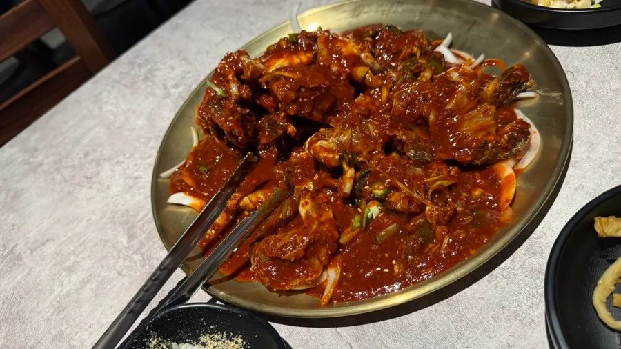 Spicy marinated crab coated in addictive sauce