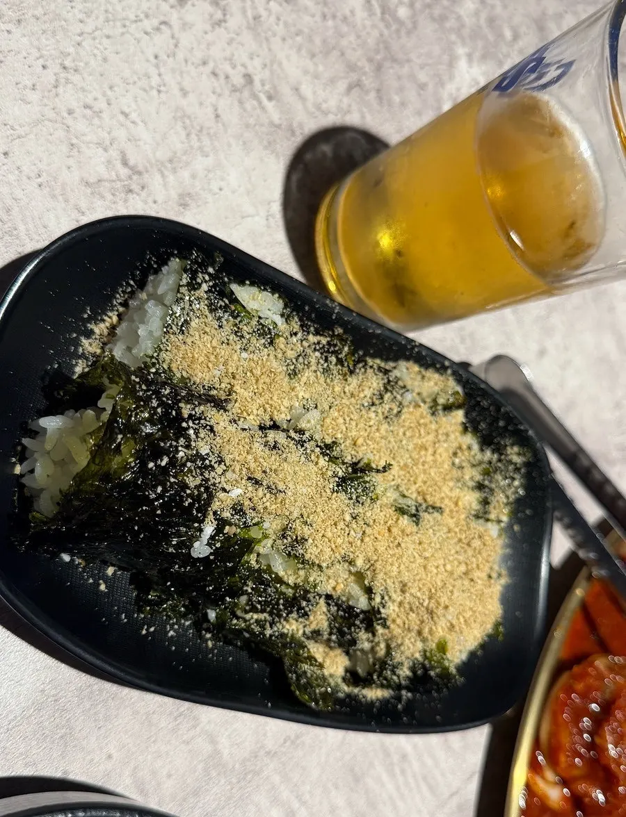 Salt gimbap dipped in the spicy crab sauce
