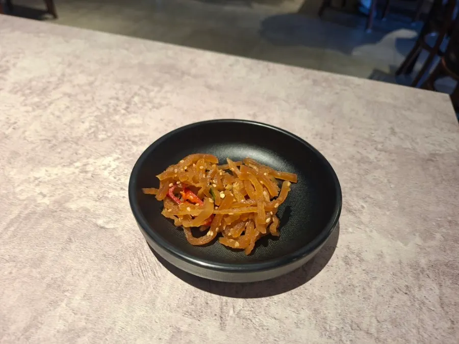 Pickled vegetables and danmuji complimentary snacks