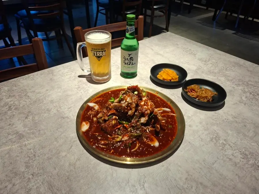 A full spread of spicy marinated crab