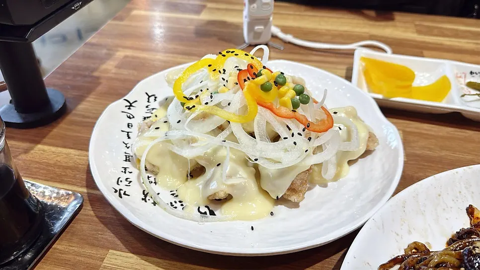 Menu listing spicy jjajang and garlic tangsuyuk