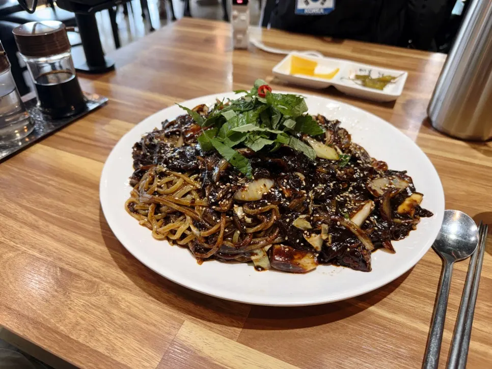 Tray jjajang noodles thickly coated in black bean sauce