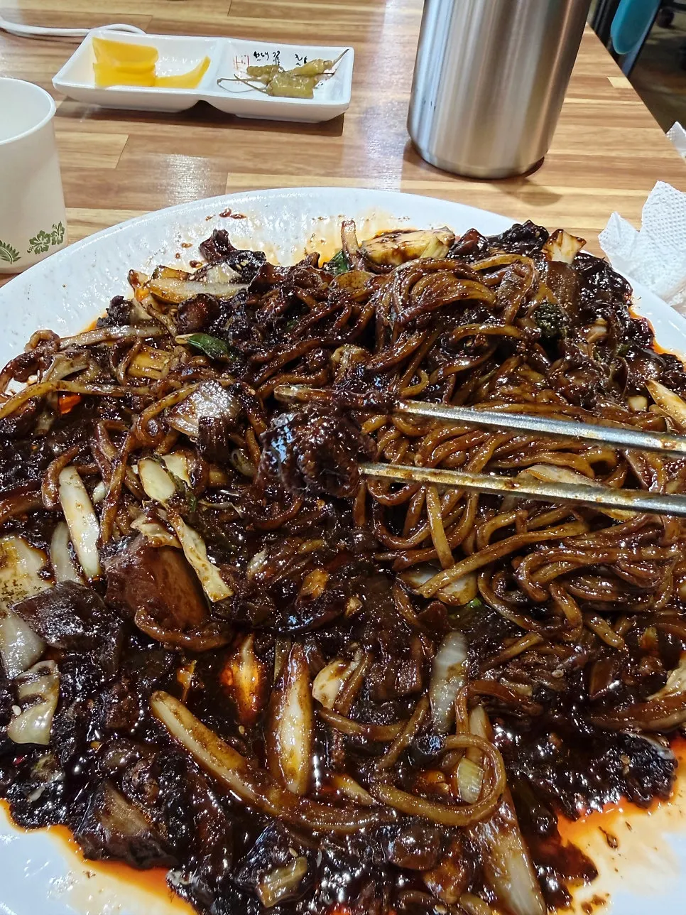 A piece of meat thickly coated in black bean sauce
