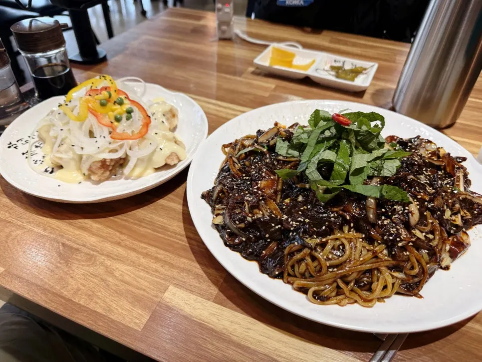 Tray jjajang topped with perilla leaves