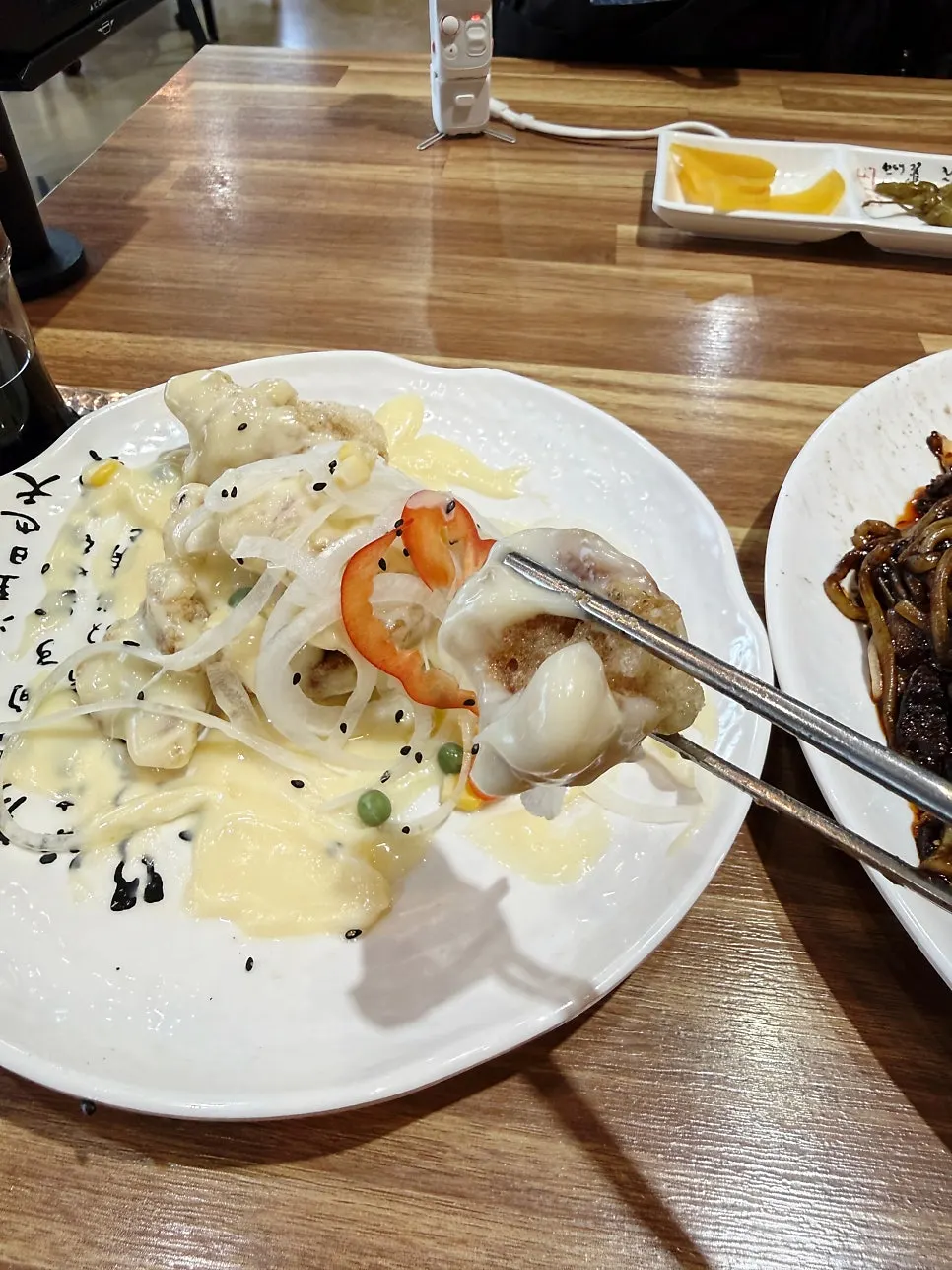 Cream tangsuyuk generously topped with pale cream sauce