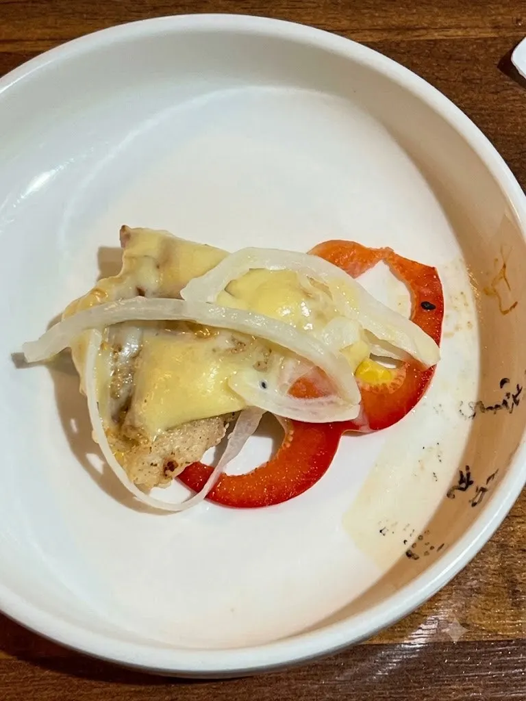 Cream tenderloin tangsuyuk topped with onion