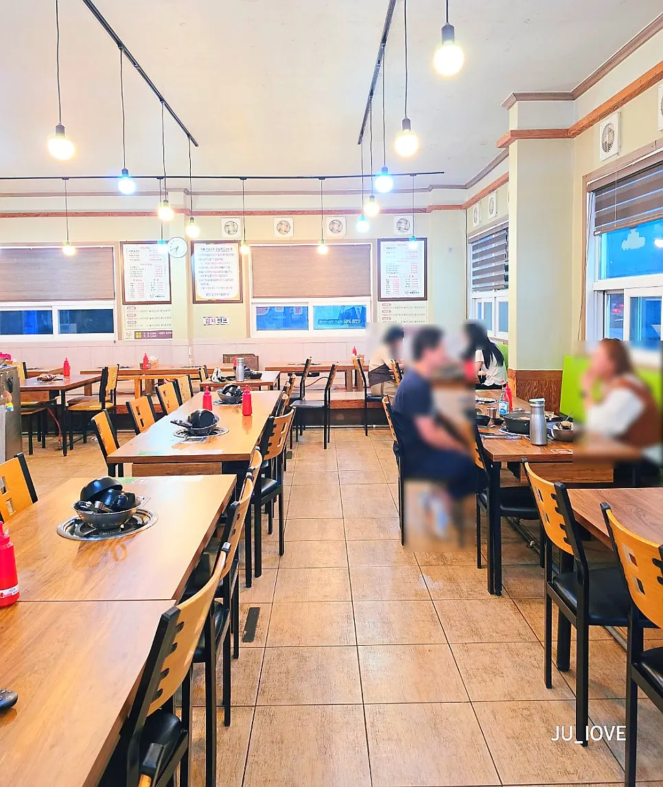 Dining hall with table and floor seating at the kalguksu restaurant