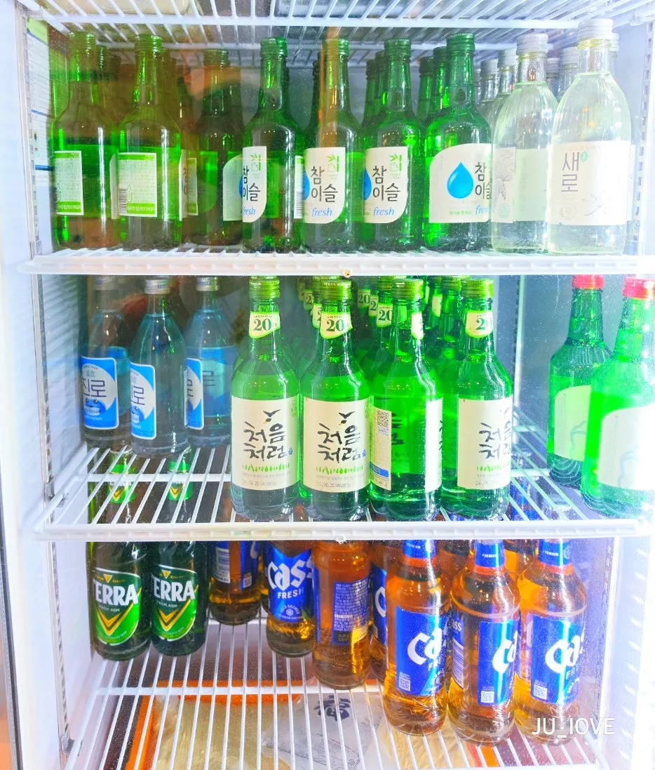Sign announcing discounted soju, beer, and makgeolli prices