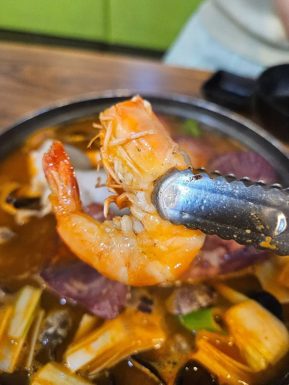 Whole octopus and a large chunk of squid in the soup