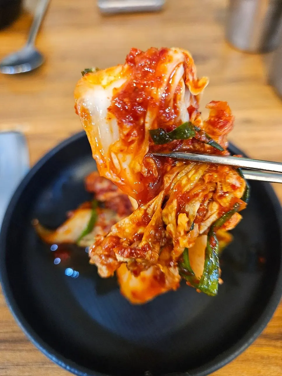 Spicy seafood kalguksu broth simmering