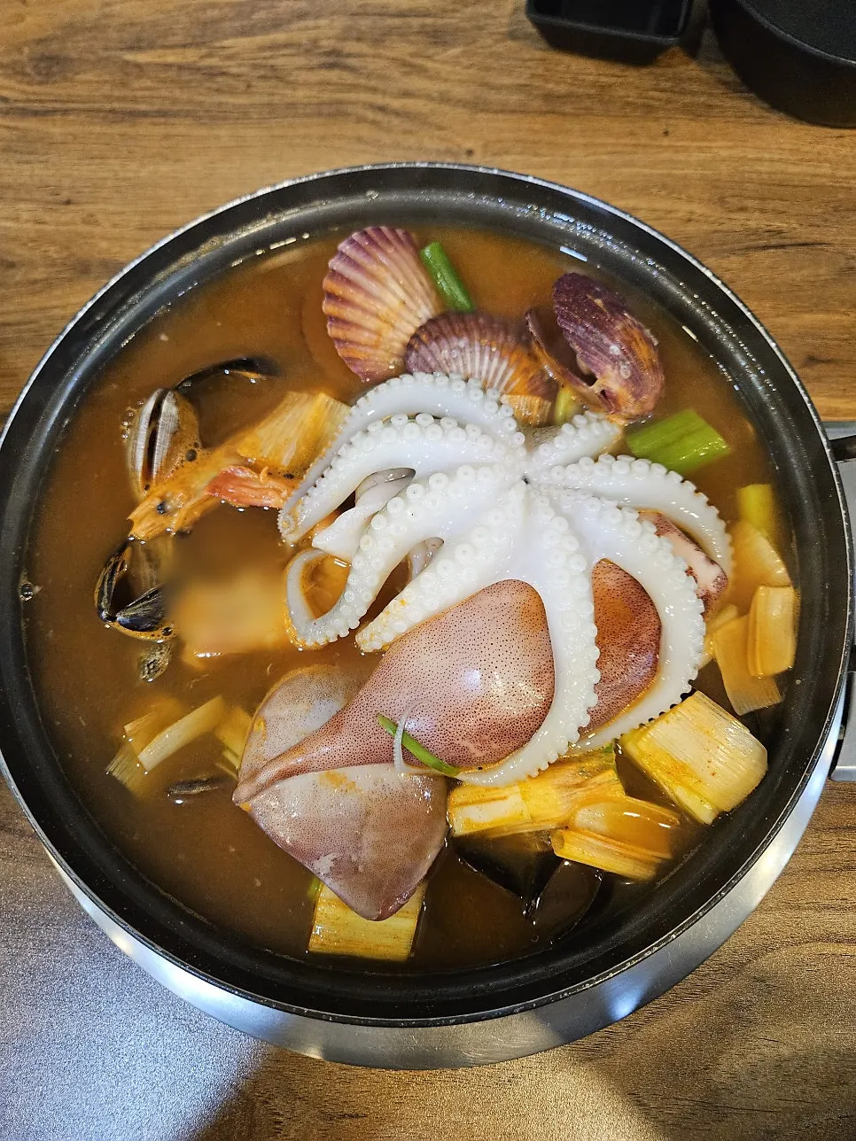 Chewy hand-cut noodles added into the rich broth