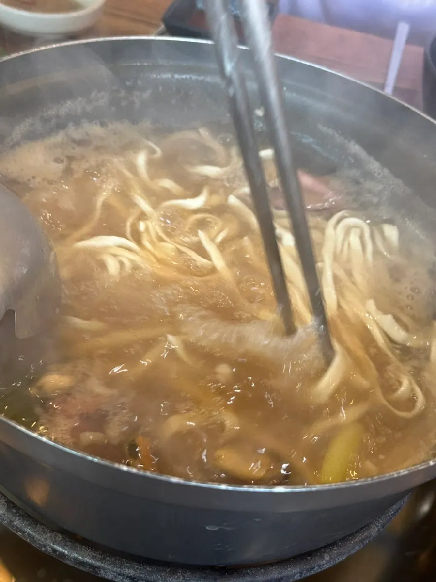 Chewy kalguksu noodles simmered in the broth