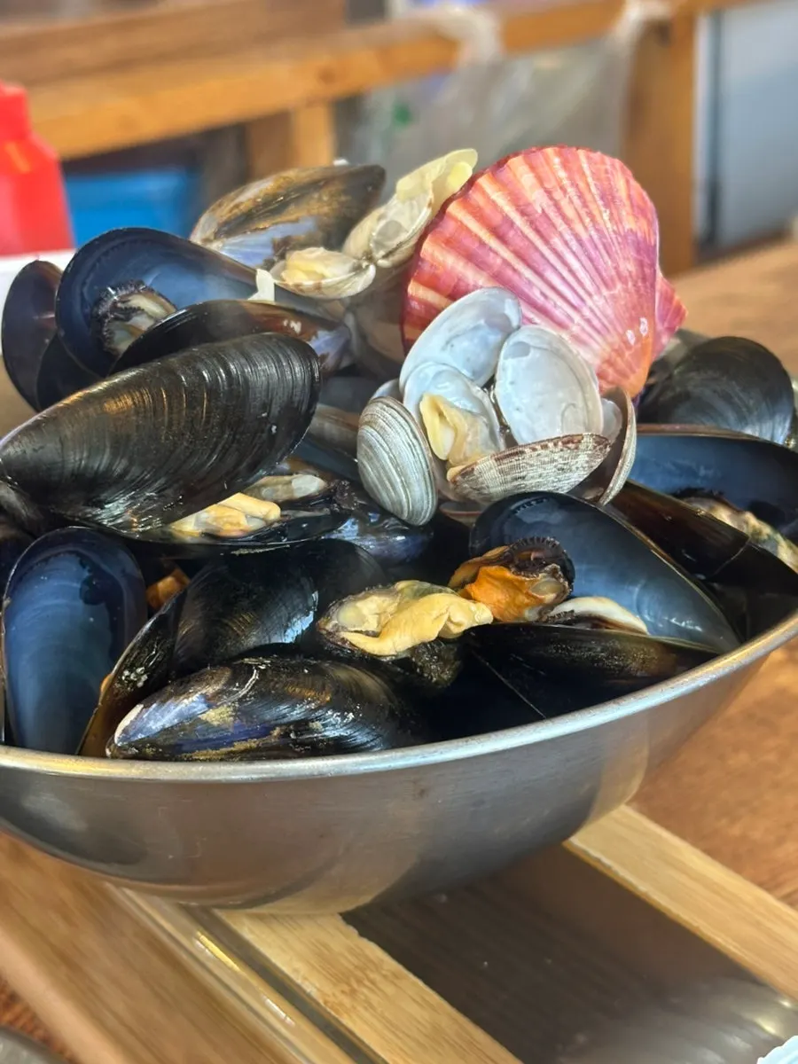 Bowl piled high with clam and mussel shells