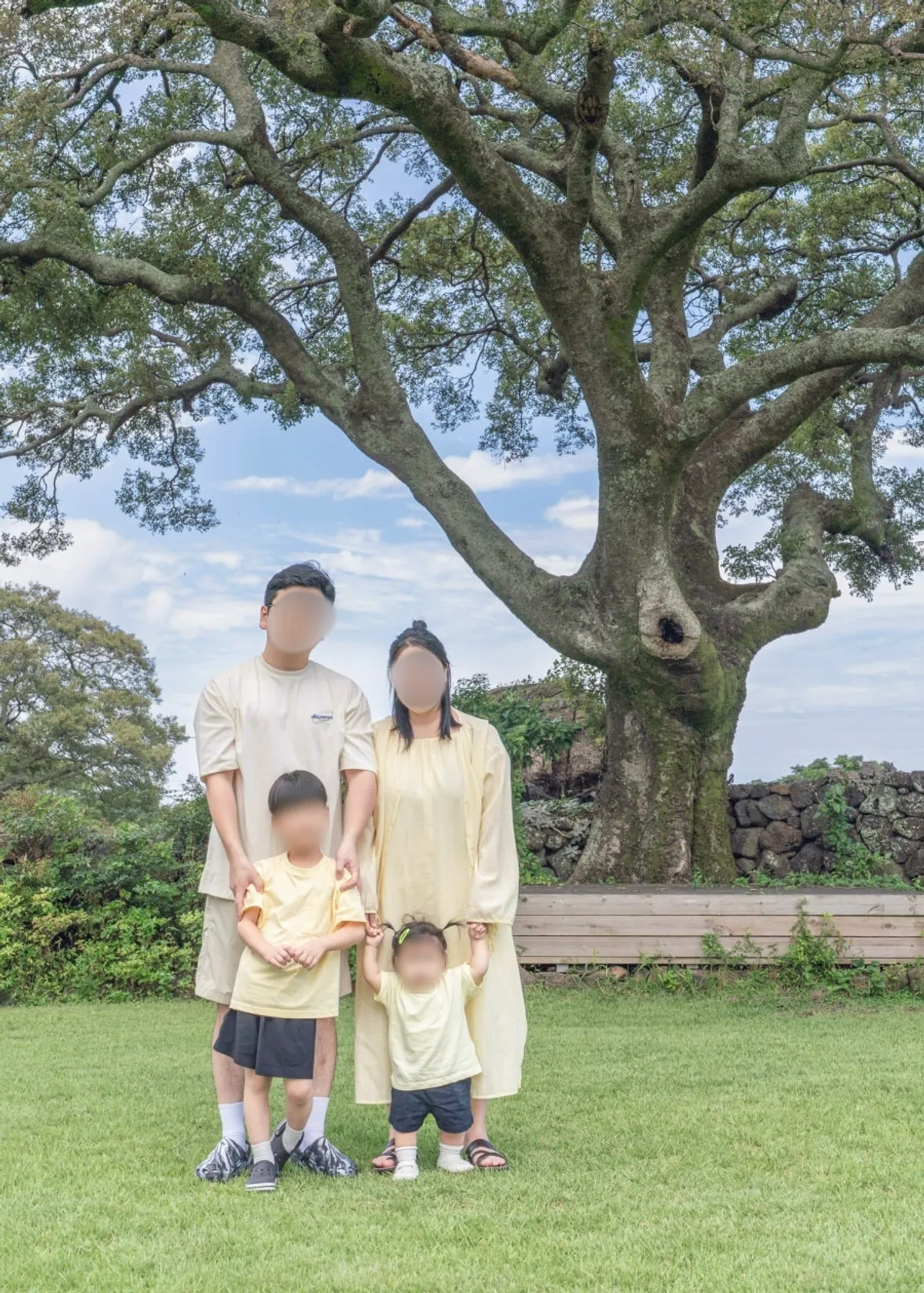 Family of four photographed under the hackberry tree