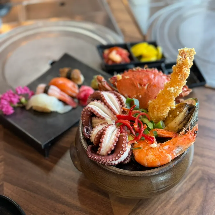 Mungaeomeong's jar seafood ramyeon piled high with seafood