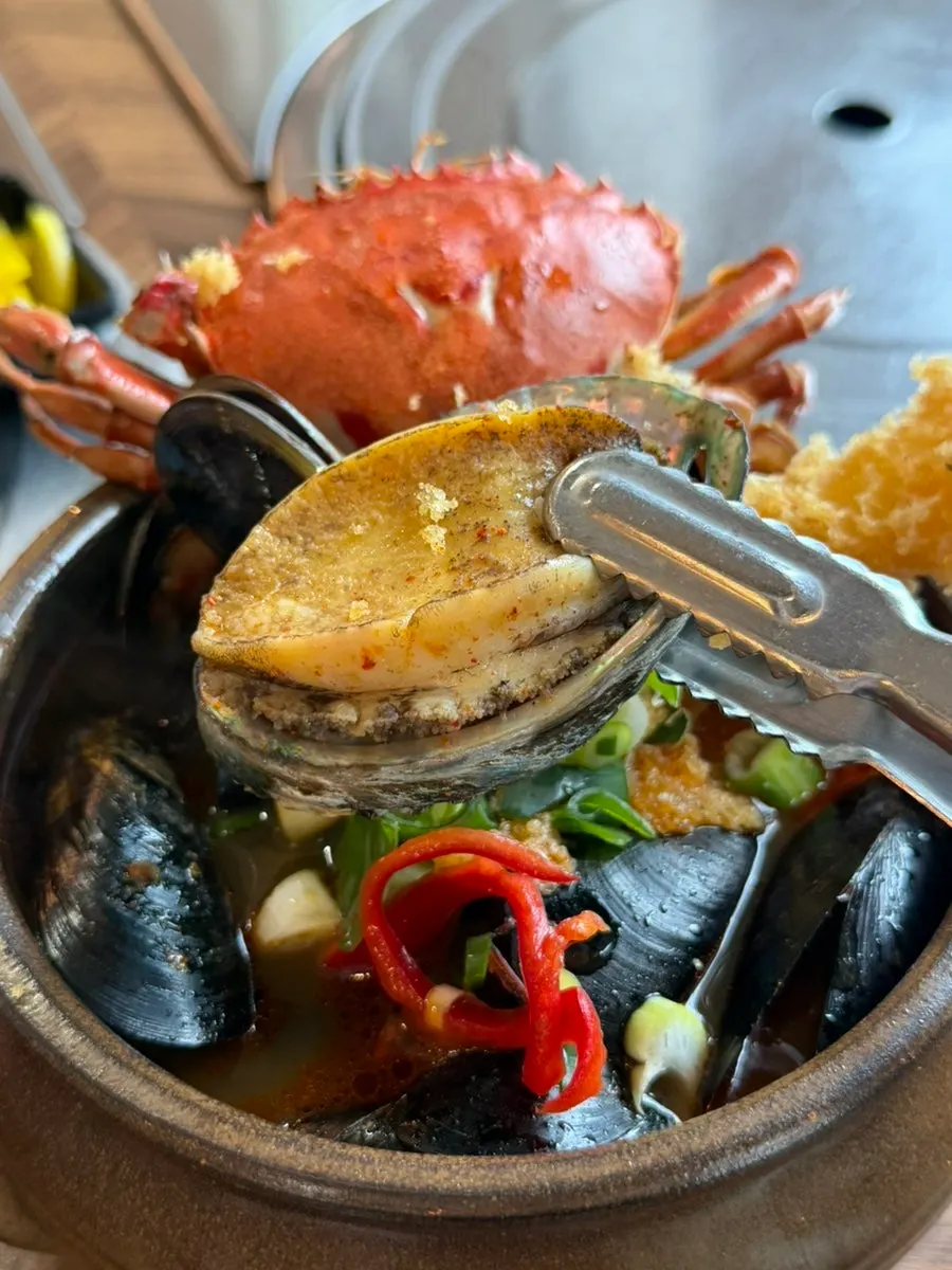 Boiled octopus picked up with chopsticks