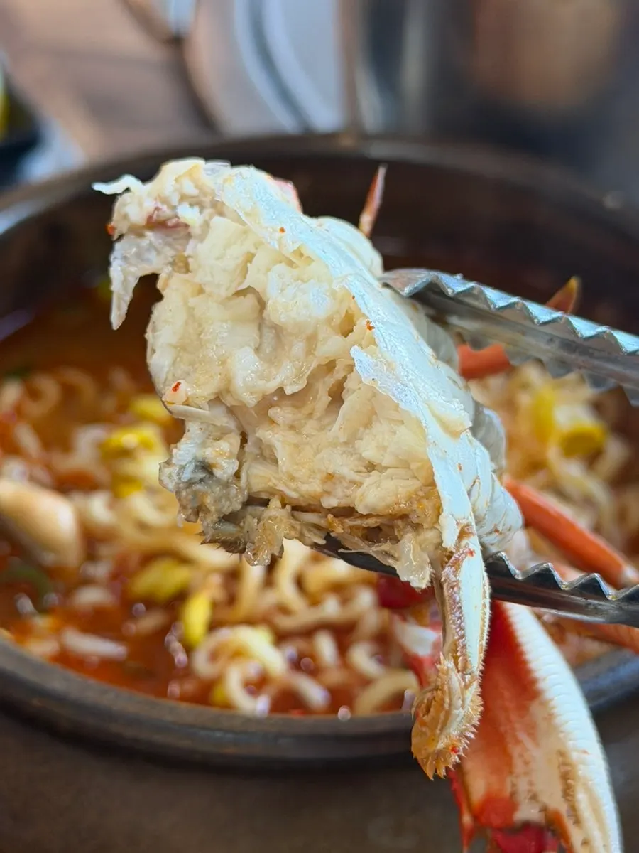 Blue crab on top of the ramyeon