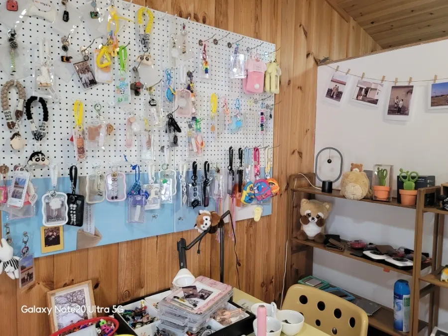 Colorful keyrings and bags displayed across the wall