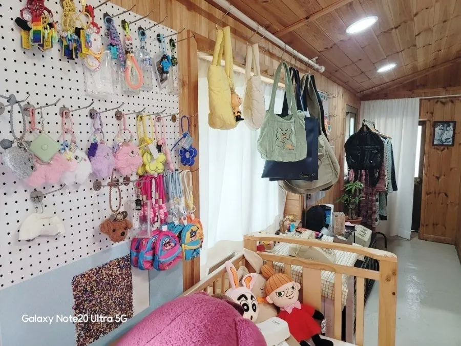 Cute dolls and nostalgic props arranged on a shelf