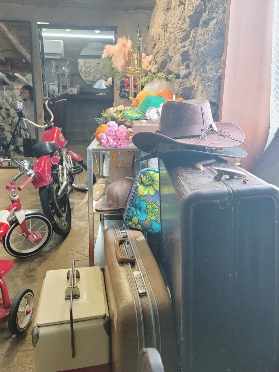 Self-photo shoot using a leather travel trunk and hat
