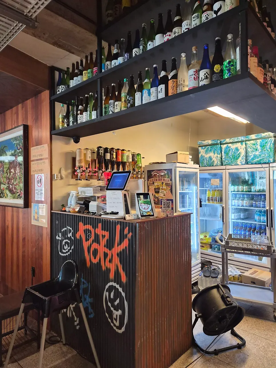 Vertical photo of the restaurant's guide sign at Pork80 Jeju Airport Branch