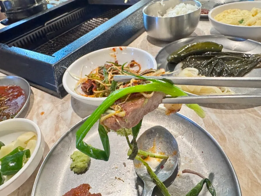 Black pork dipped into meljeot sauce