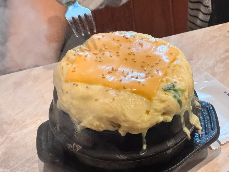 Cheese bomb egg custard topped with cheese