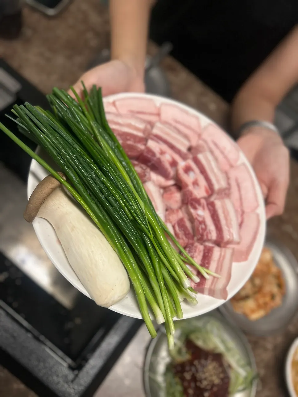 Nanchukmatdon for two with scallions and king oyster mushrooms on one plate