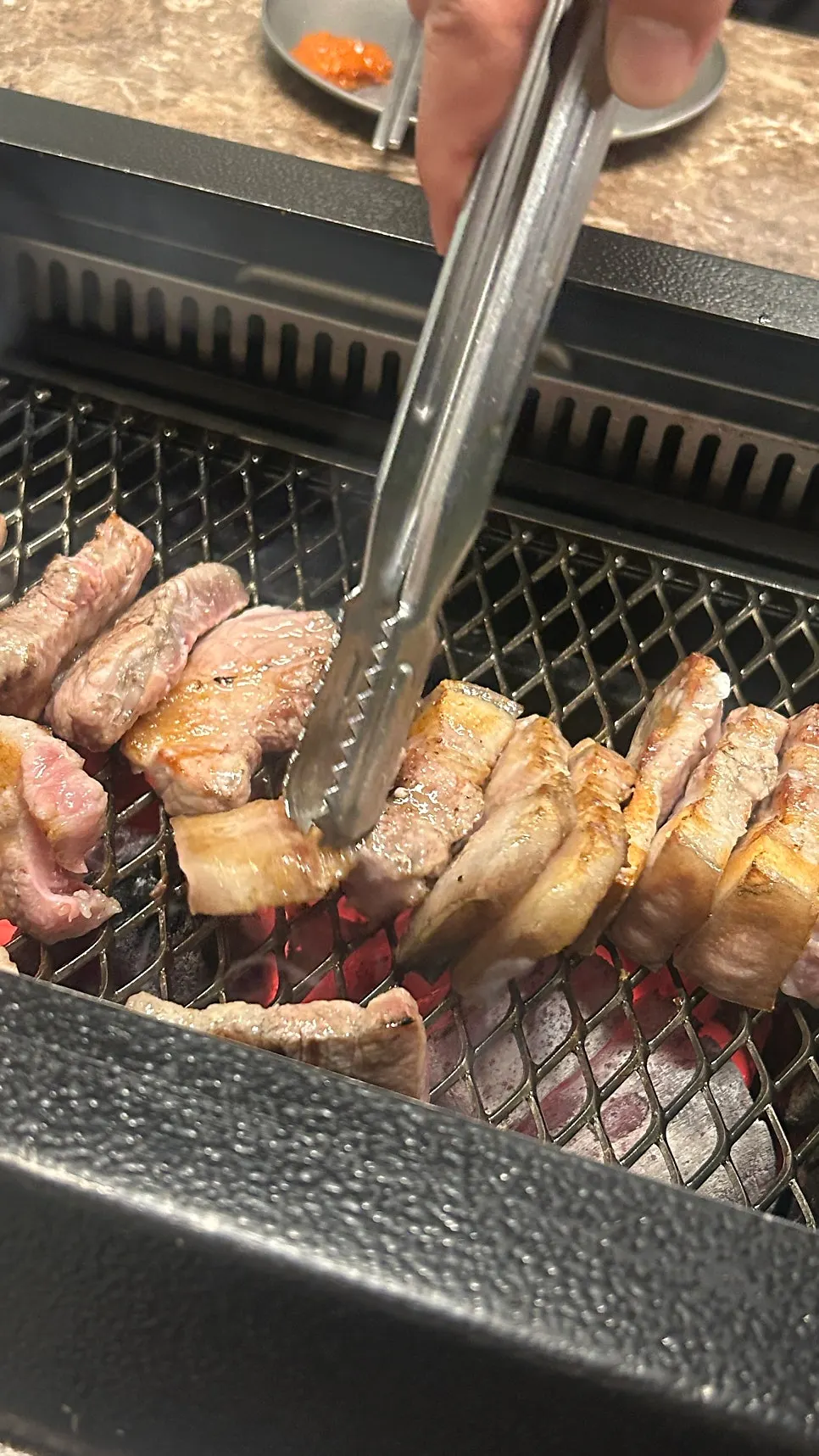 Staff grilling nanchukmatdon on the grill plate
