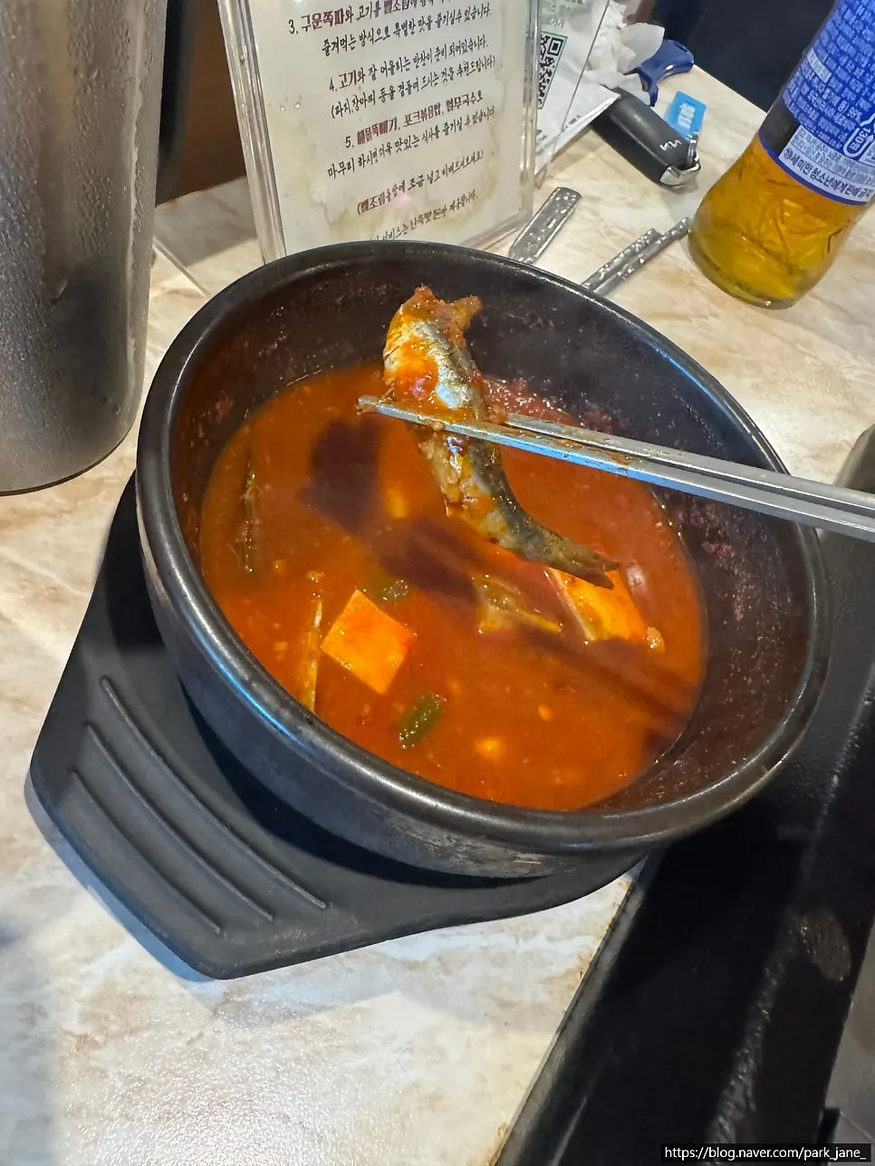 Black pork table setting with the stew-bowl meljeot