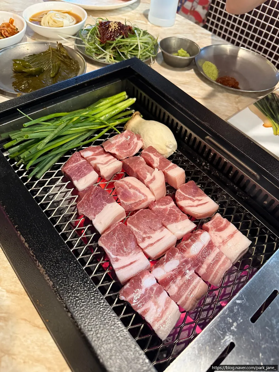 Staff grilling the black pork