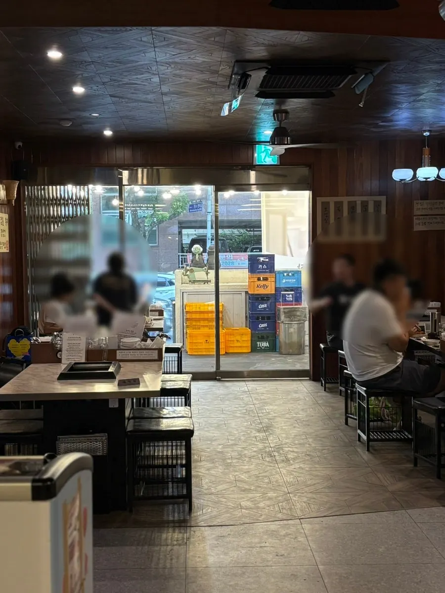 Sign for Pork80, a black pork restaurant near the airport