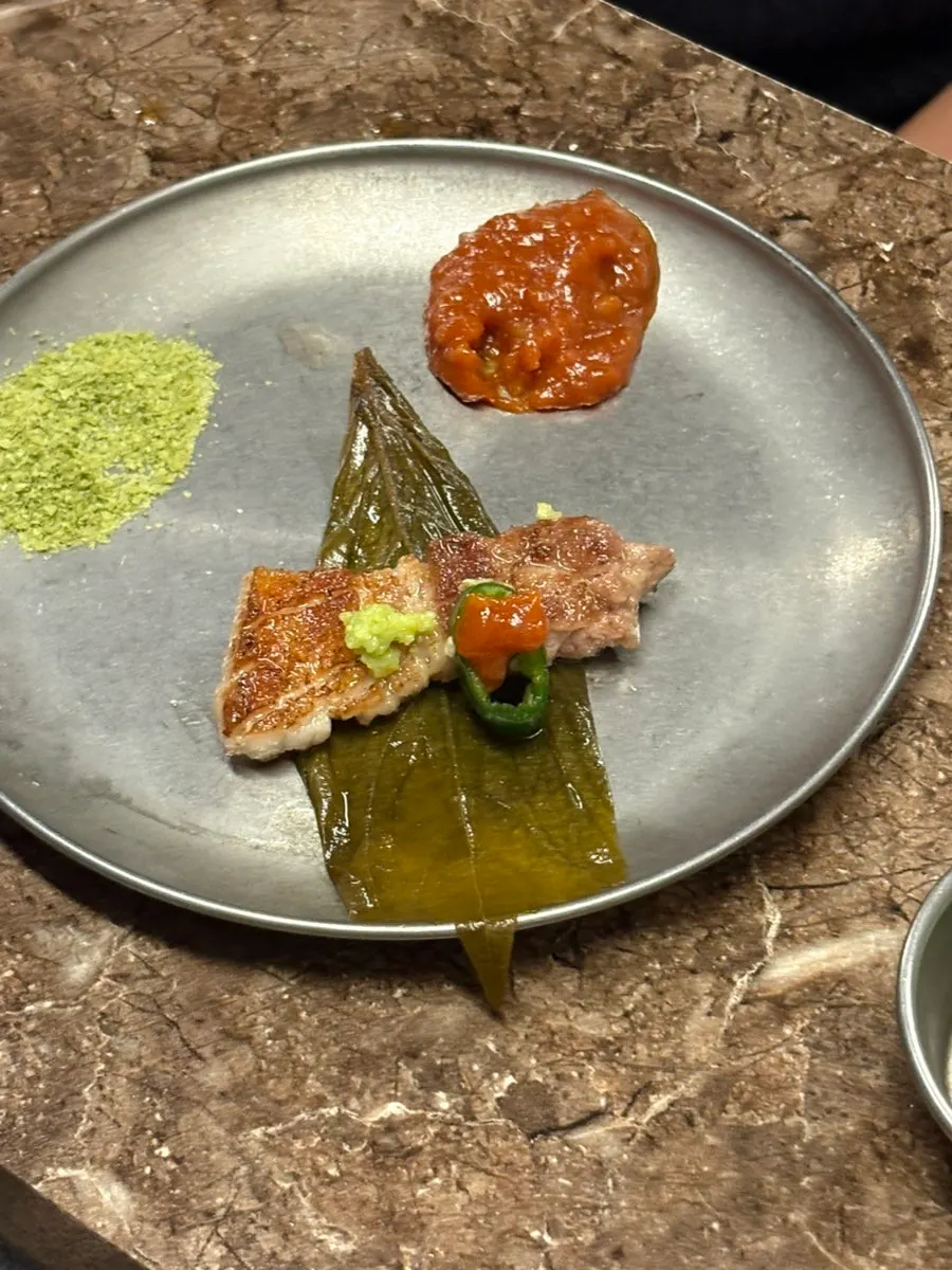 Black pork topped with pickled perilla leaf and wasabi