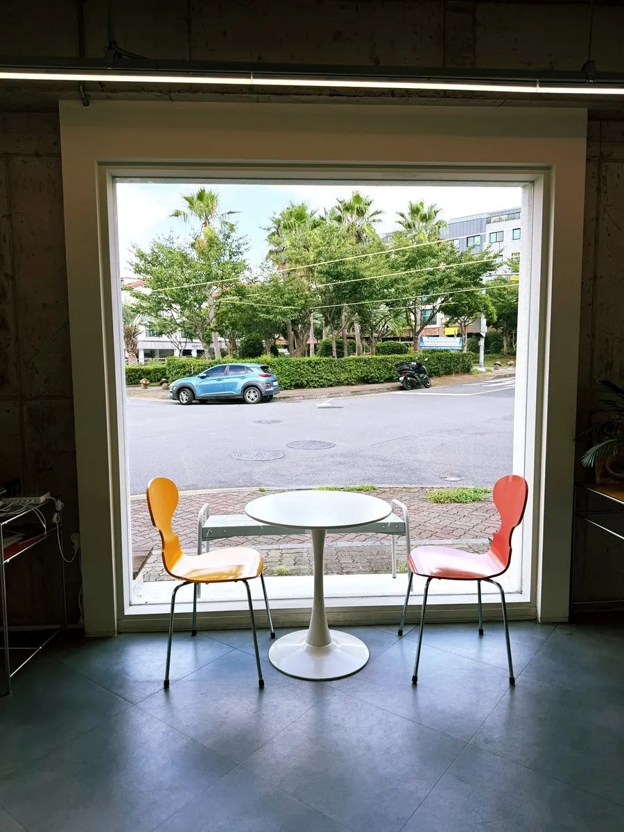 Interior of Gluttony Coffee with floor-to-ceiling windows