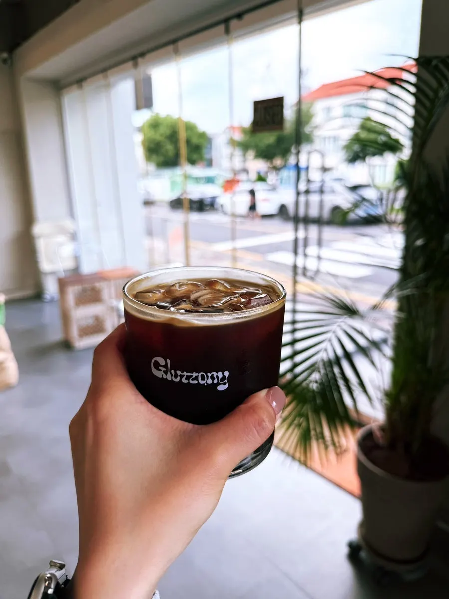 Drinking the Gluttony latte by the window