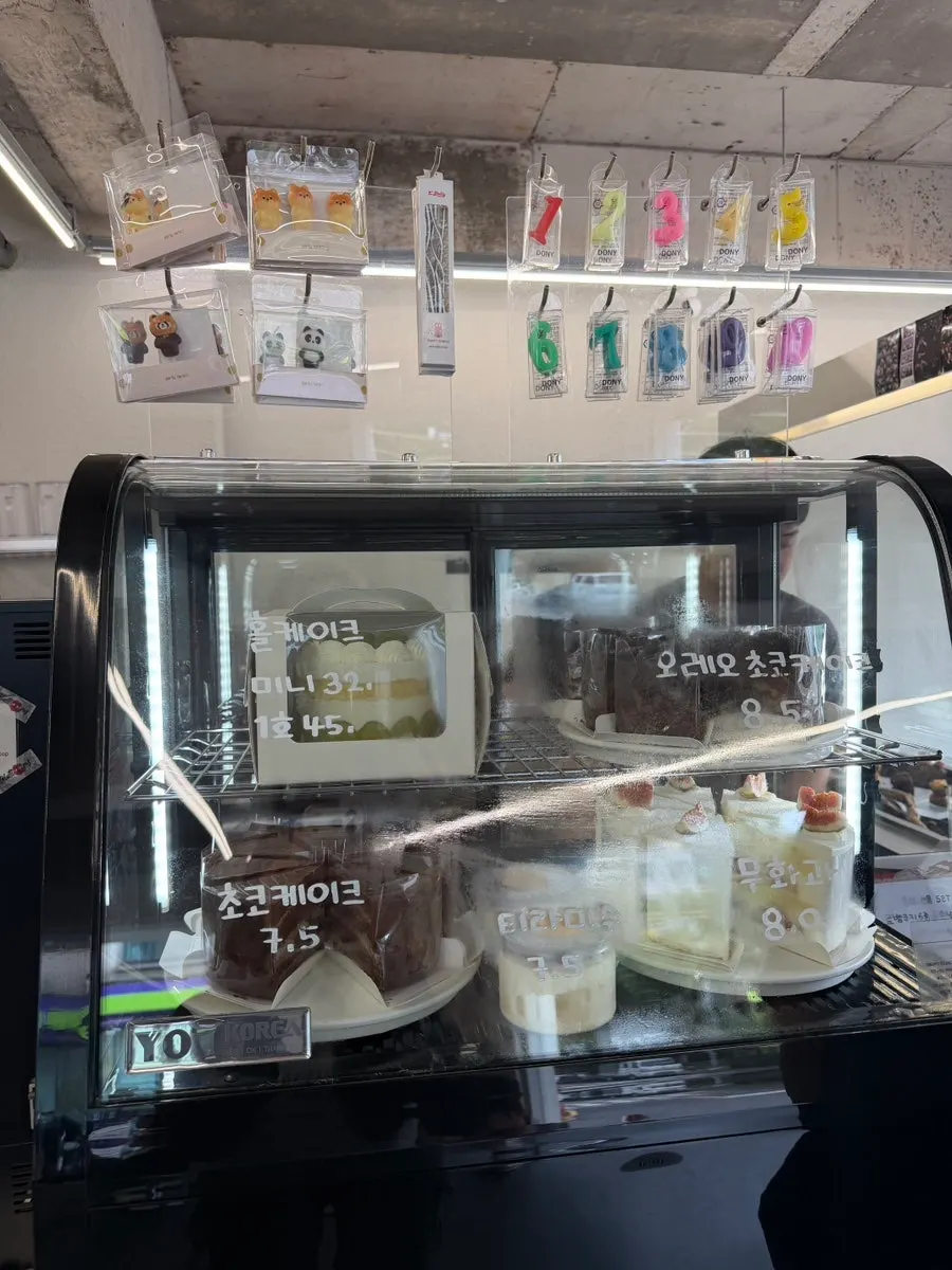 Various cakes inside the display case