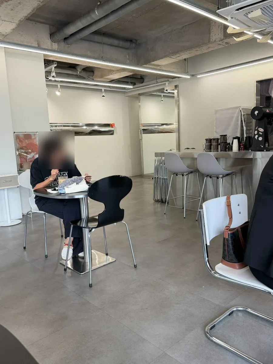 Café interior nearly full of customers