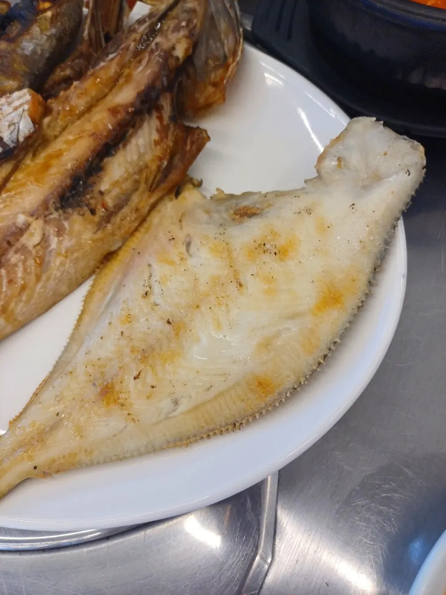 A full meal of grilled fish and soft tofu stew
