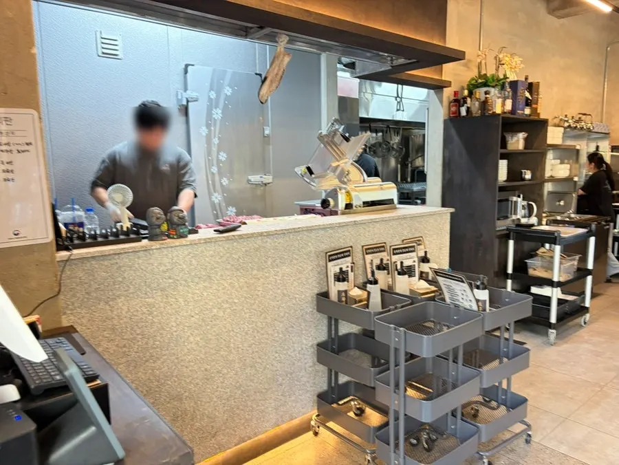 Interior of Dolgyeok Hanwoo with its open kitchen