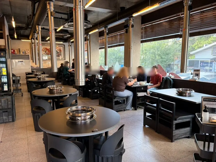 An open kitchen where meat is trimmed right in front of you