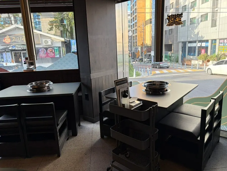Dining seats at Dolgyeok Hanwoo with a black interior