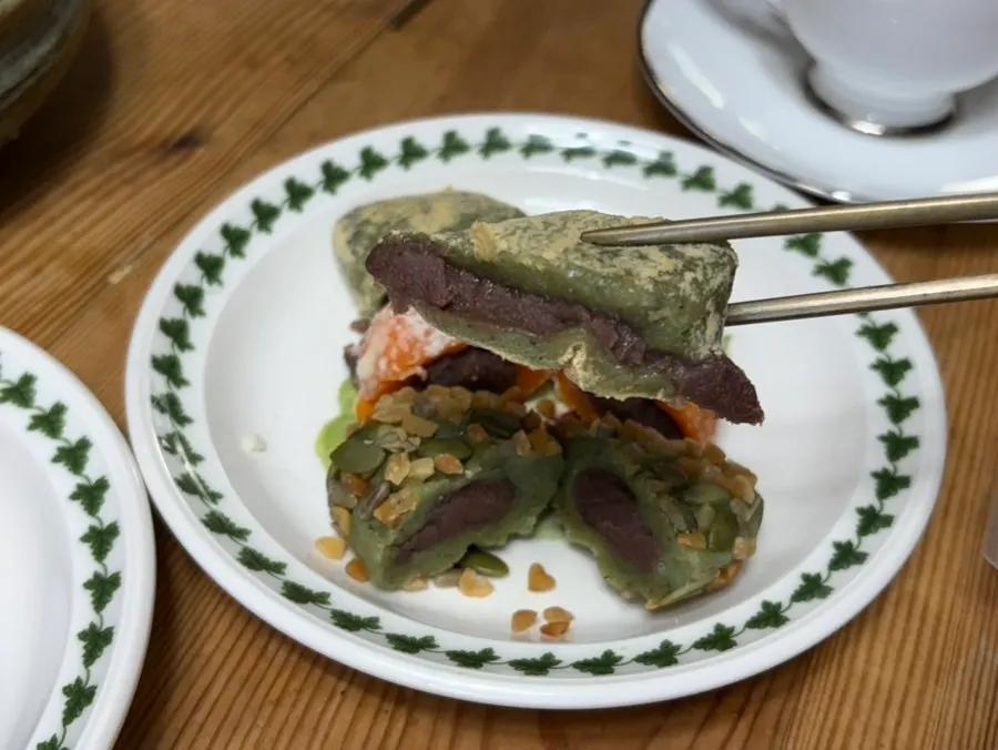 Tangerine omegi-tteok cut in half